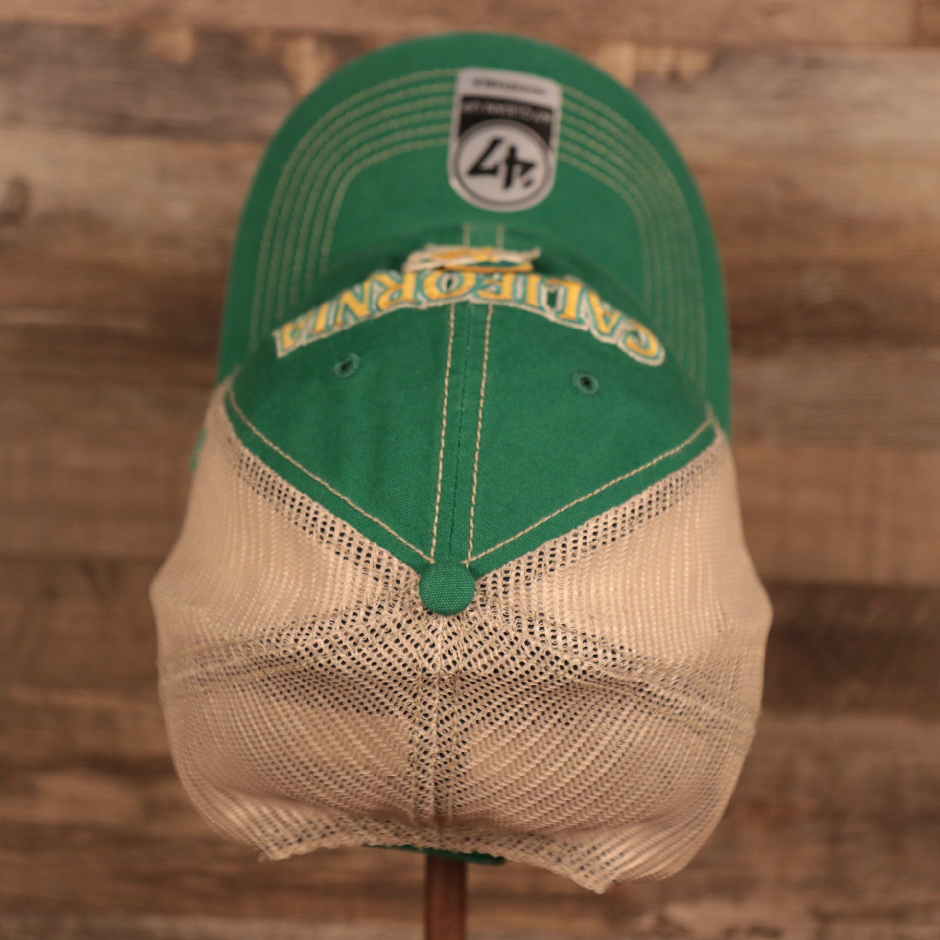 top view of the California Golden Seals Green and Yellow Retro Adjustable Trucker Dad Hat