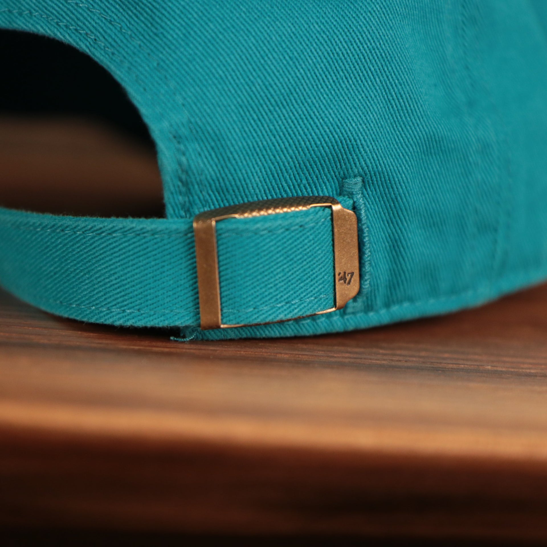 adjustable snap on the back of the Charlotte Hornets Cyan Adjustable Dad Hat