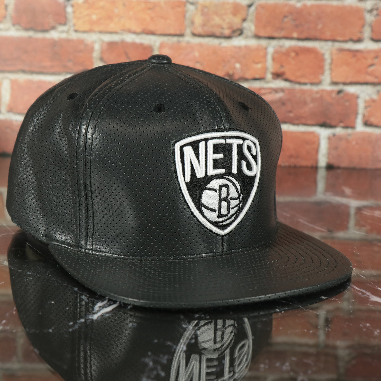 Brooklyn Nets 100% Genuine Perforated Leather Mitchell and Ness Snapback Hat