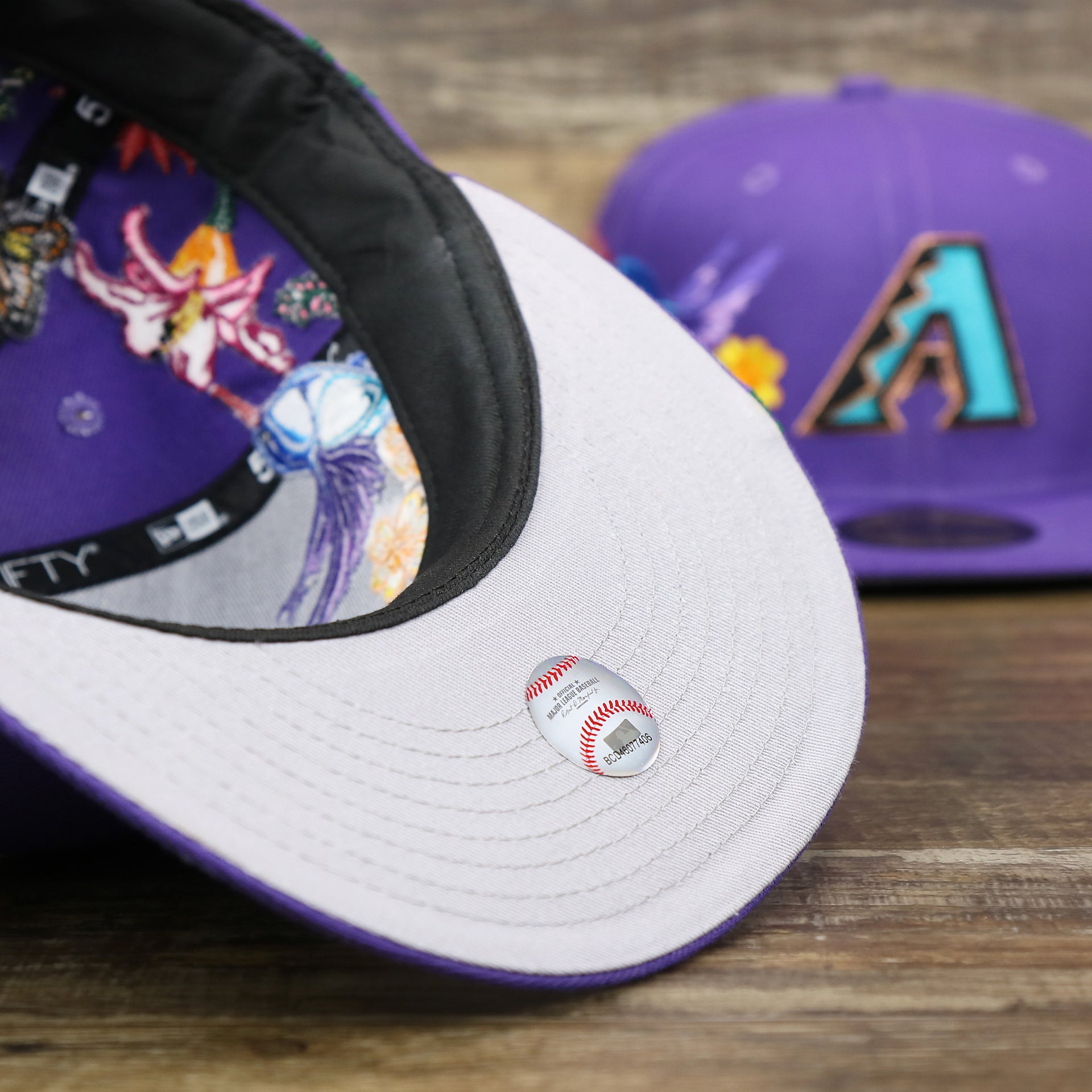 The undervisor on the Cooperstown Arizona Diamondbacks Gray Bottom Bloom Spring Embroidery 59Fifty Fitted Cap | Purple 59Fifty Cap