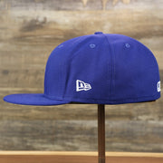The wearer's left of the Los Angeles Dodgers Gray Bottom Bloom Spring Embroidery 59Fifty Fitted Cap | Royal Blue 59Fifty Cap