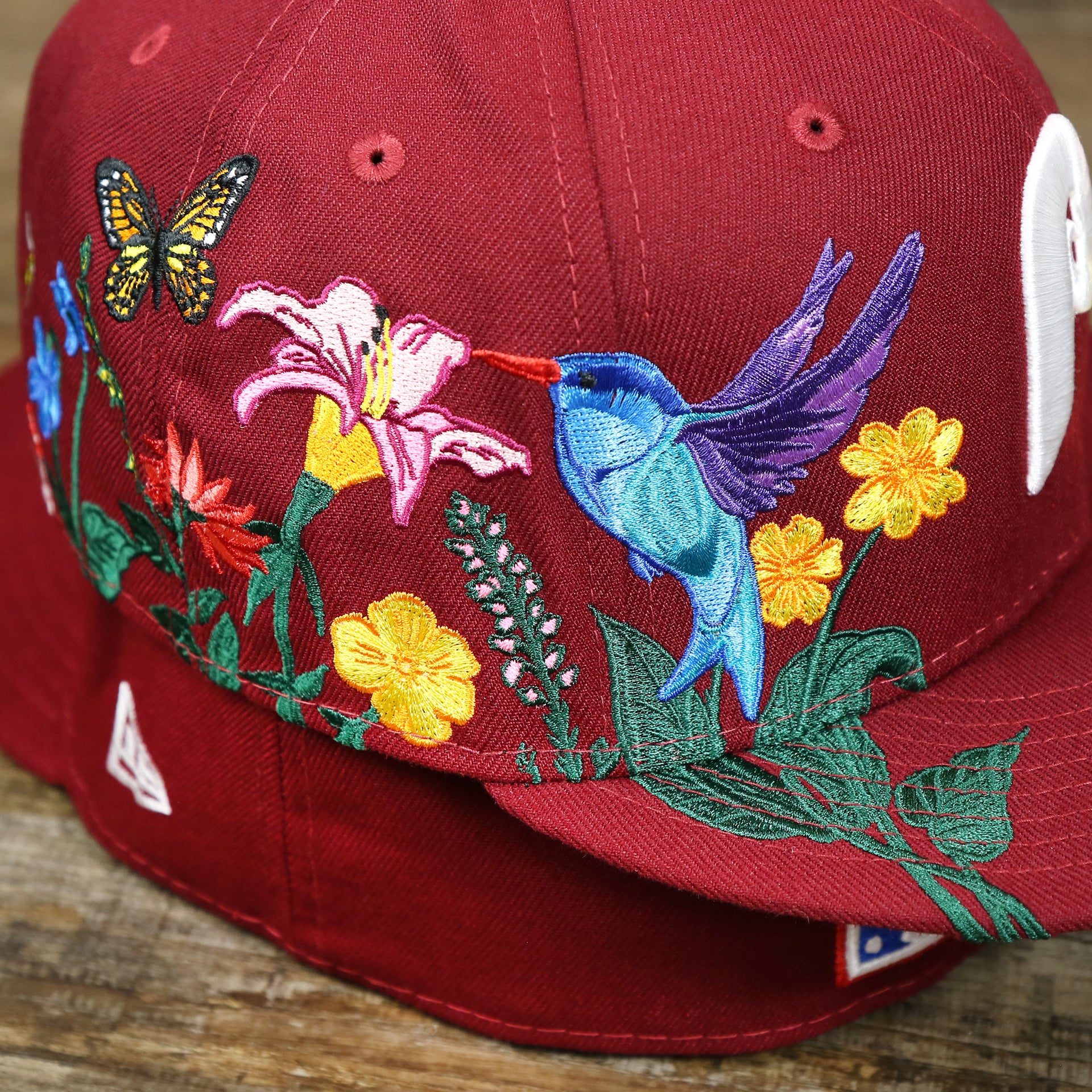 The bloom embroidery on the Cooperstown Philadelphia Phillies Gray Bottom Bloom Spring Embroidery 59Fifty Fitted Cap | Maroon 59Fifty Cap