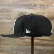 The wearer's left of the Chicago White Sox Gray Bottom Bloom Spring Embroidery 59Fifty Fitted Cap | Black 59Fifty Cap