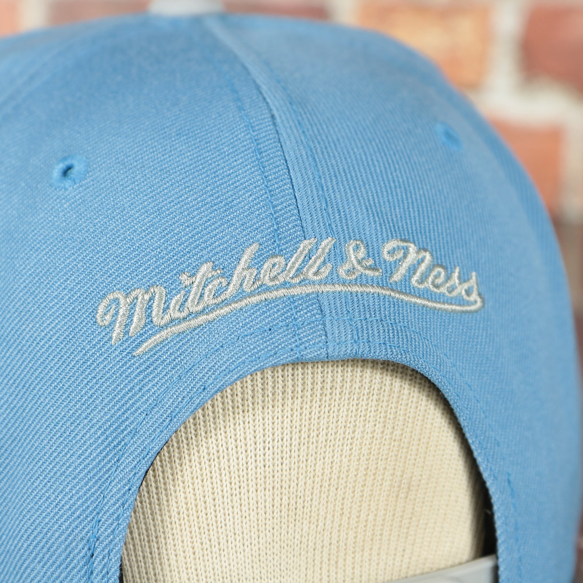 mitchell and ness logo on the MITCHELL AND NESS REFLECTIVE TRI POP SNAPBACK, NEW YORK CITY FOOTBALL CLUB, OSFM