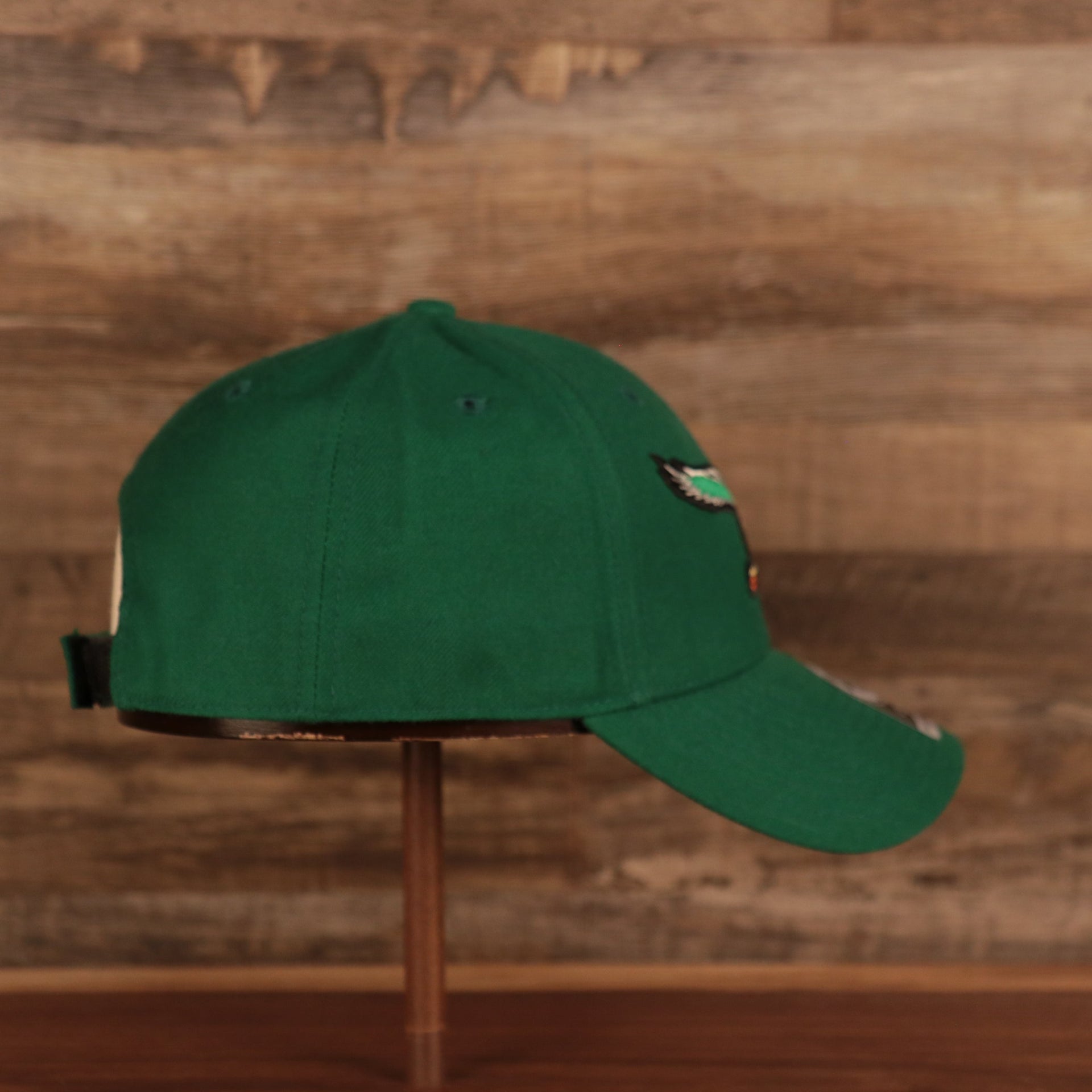 wearers right side of the Philadelphia Eagles Throwback Kelly Green Adjustable Dad Hat OSFM