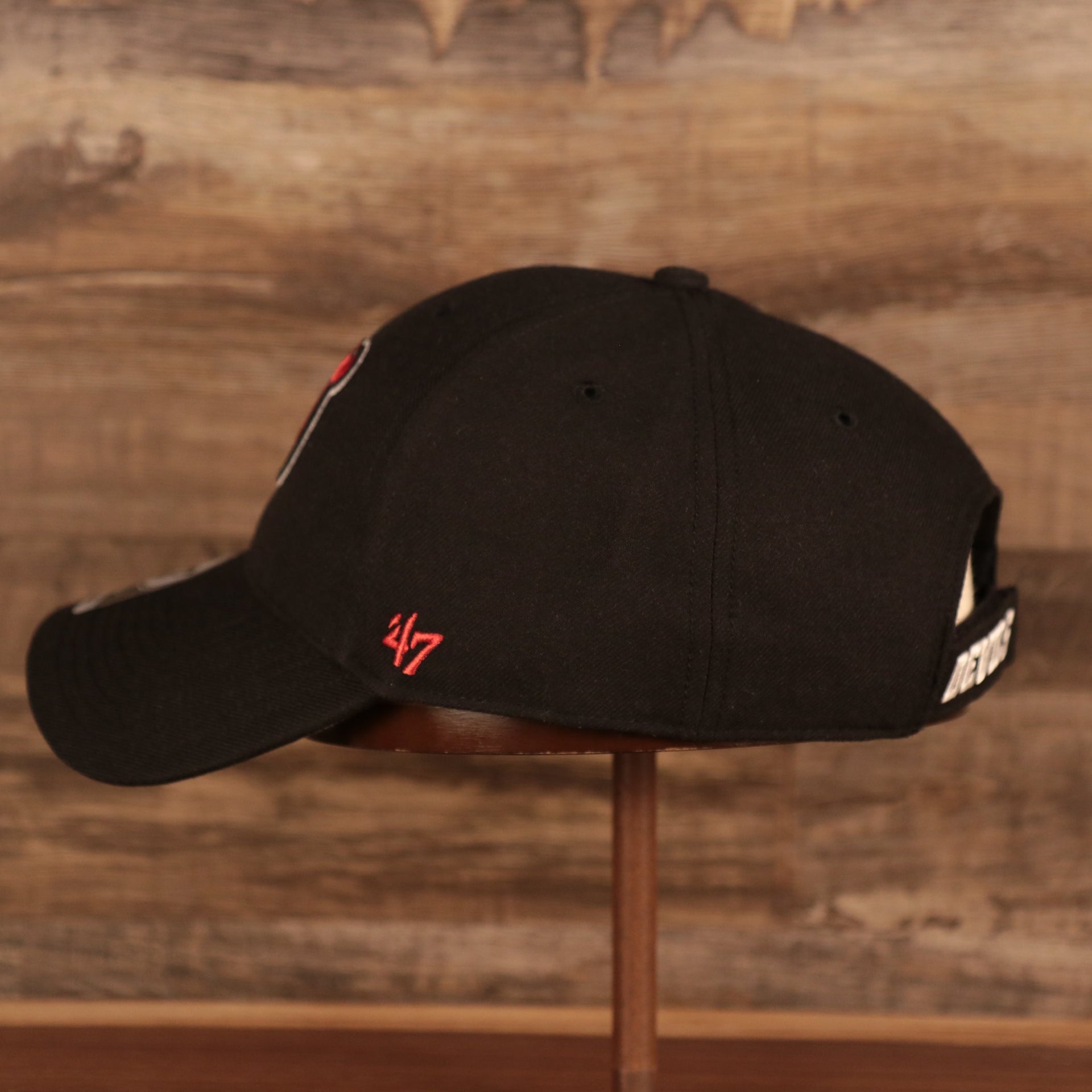 wearers left side of the New Jersey Devils Black Adjustable Dad Hat