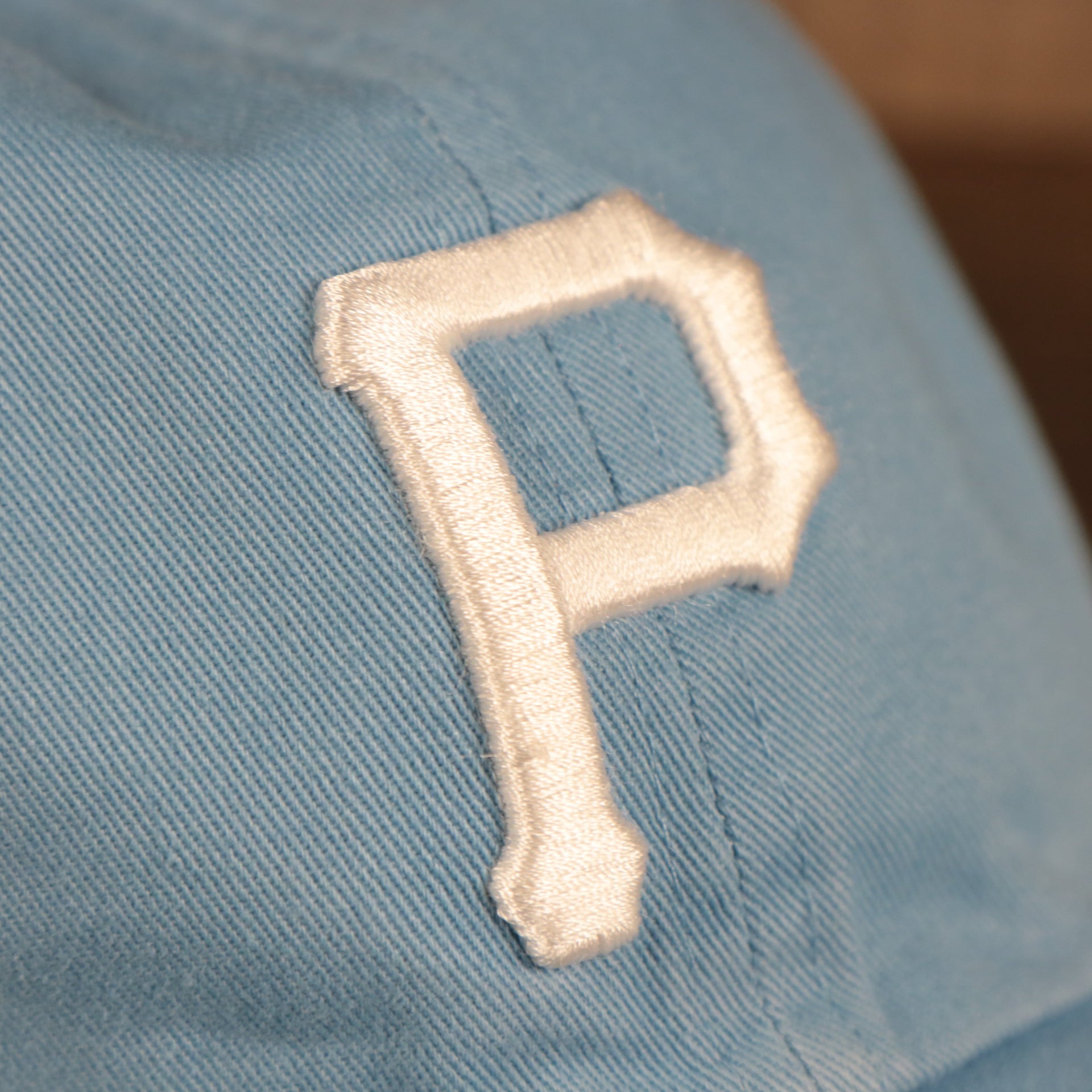 Pittsburgh Pirates Pink Bottom Icy Blue Clean Up Dad Hat  Up close front-right view of Pittsburgh Pirates logo of the cap