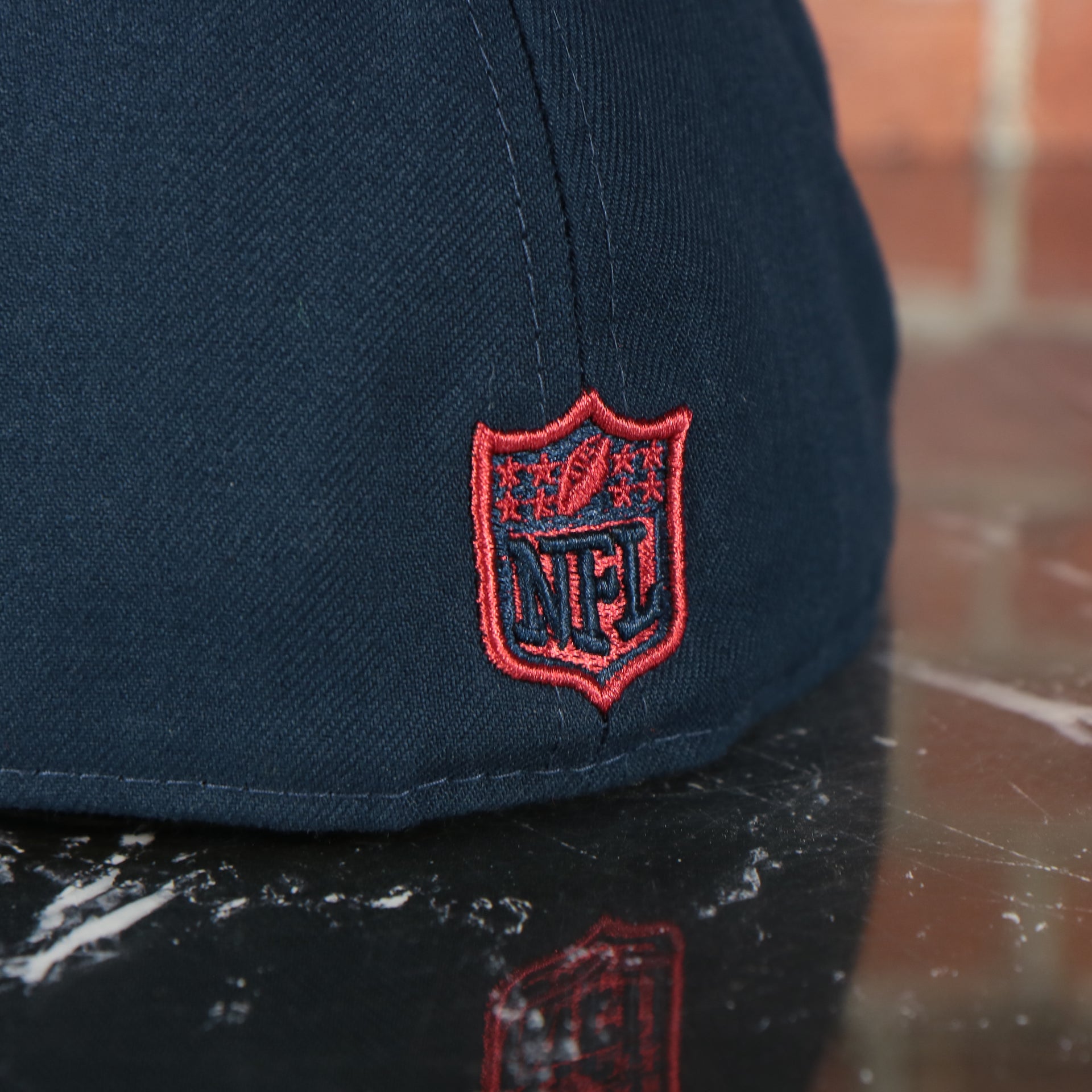 NFL logo on the New England Patriots Tribute Turn Grey Bottom | Navy 59Fifty Fitted Cap