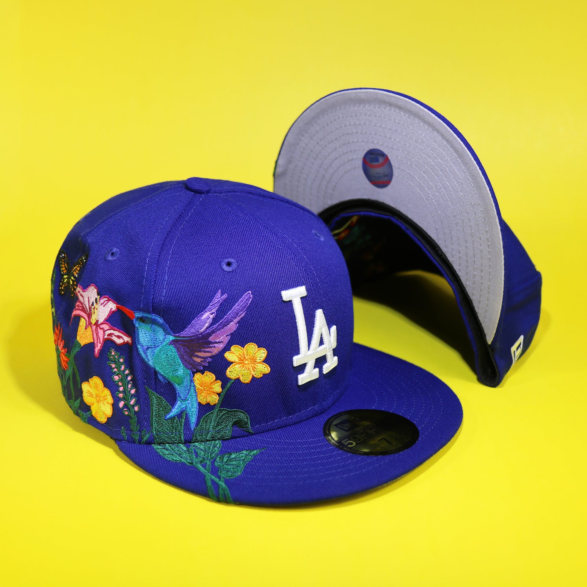 The Los Angeles Dodgers Gray Bottom Bloom Spring Embroidery 59Fifty Fitted Cap | Royal Blue 59Fifty Cap and another undervisor