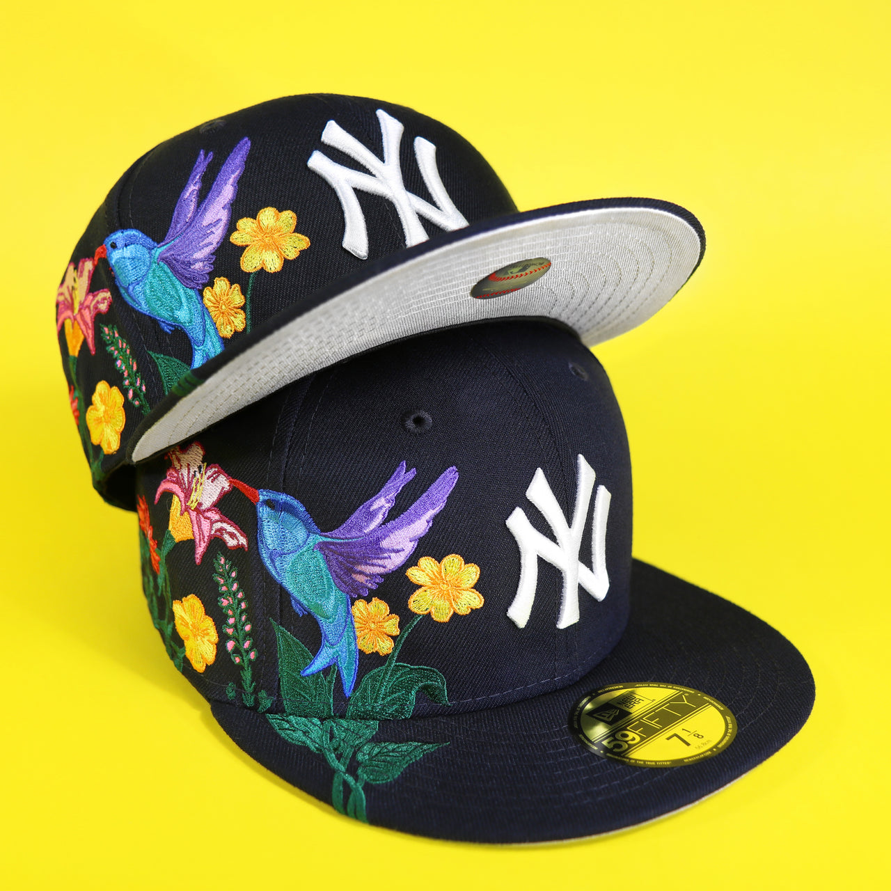 The New York Yankees Gray Bottom Bloom Spring Embroidery 59Fifty Fitted Cap | Navy Blue 59Fifty Cap with another cap