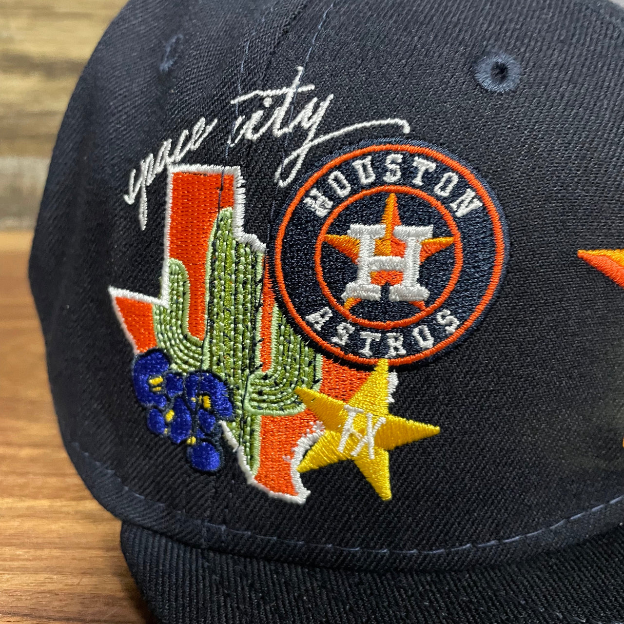 Close up of the Houston Astros "City Cluster" Side Patch Gray Bottom Navy 59Fifty Fitted Cap