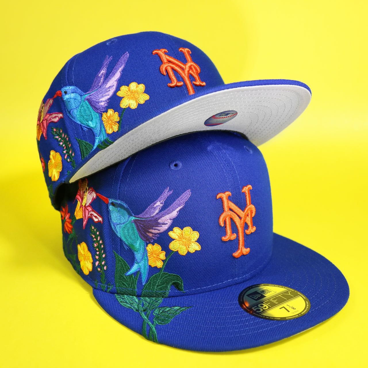 The New York Mets Gray Bottom Bloom Spring Embroidery 59Fifty Fitted Cap | Royal Blue 59Fifty Cap with another cap