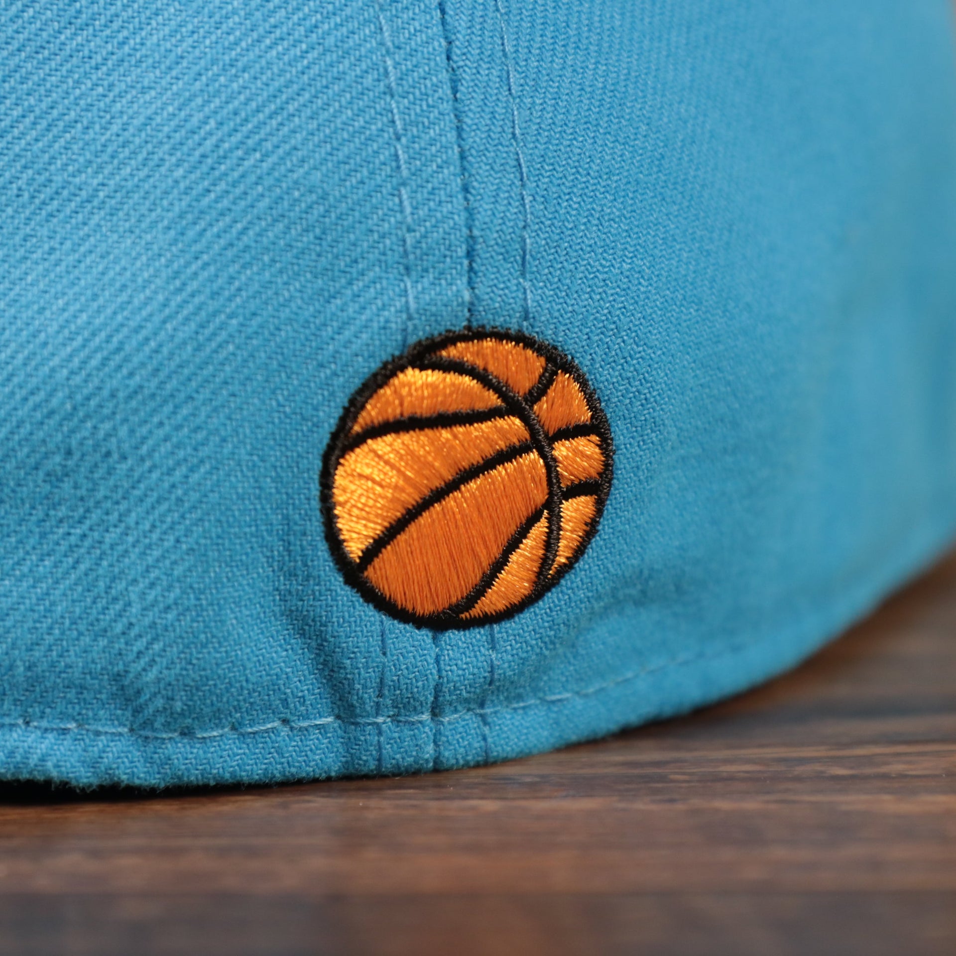 Basketball logo on the Tune Squad Shield Lebron 18 Space Jam Matching 59Fifty Fitted Cap | Blue