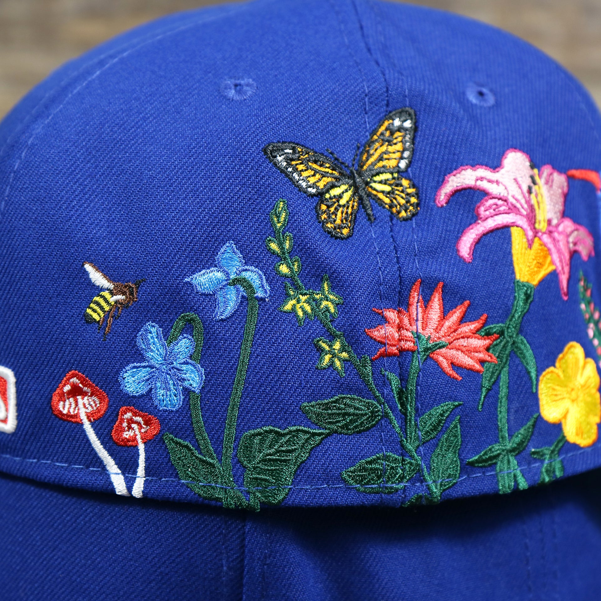 The Backside of the Bloom Patch on the New York Mets Gray Bottom Bloom Spring Embroidery 59Fifty Fitted Cap | Royal Blue 59Fifty Cap