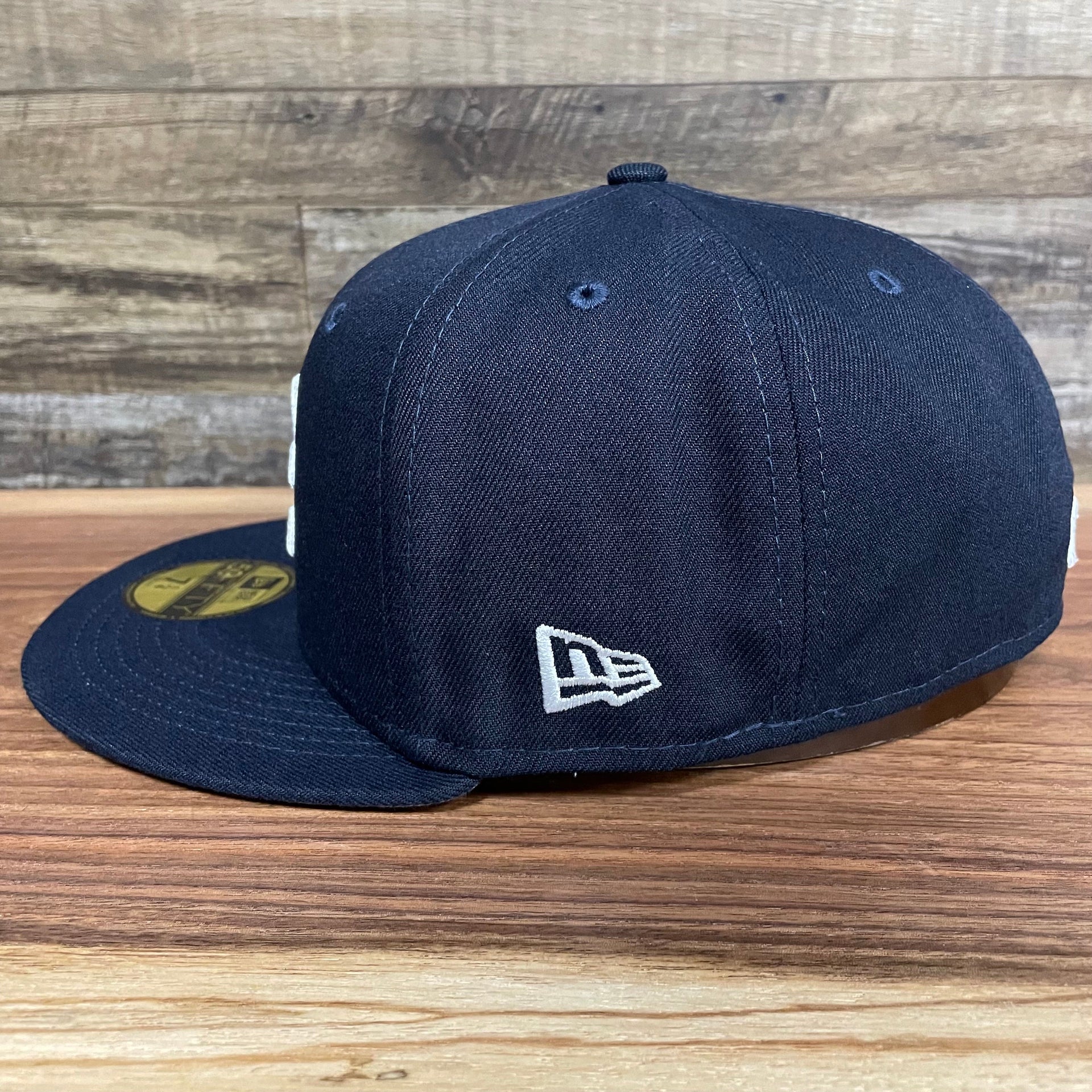 Wearer's left of the Atlanta Braves "City Cluster" Side Patch Gray Bottom Navy 59Fifty Fitted Cap