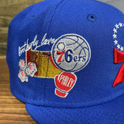 Close up of the side patch embroidery on the Philadelphia 76ers "City Cluster" Side Patch Gray Bottom Royal 59Fifty Fitted Cap