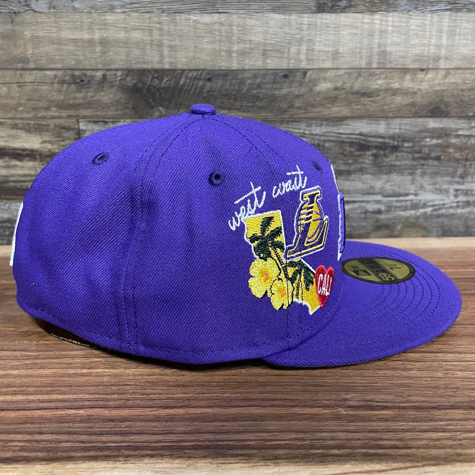 Wearer's right of the Los Angeles Lakers "City Cluster" Side Patch Gray Bottom Purple 59Fifty Fitted Cap