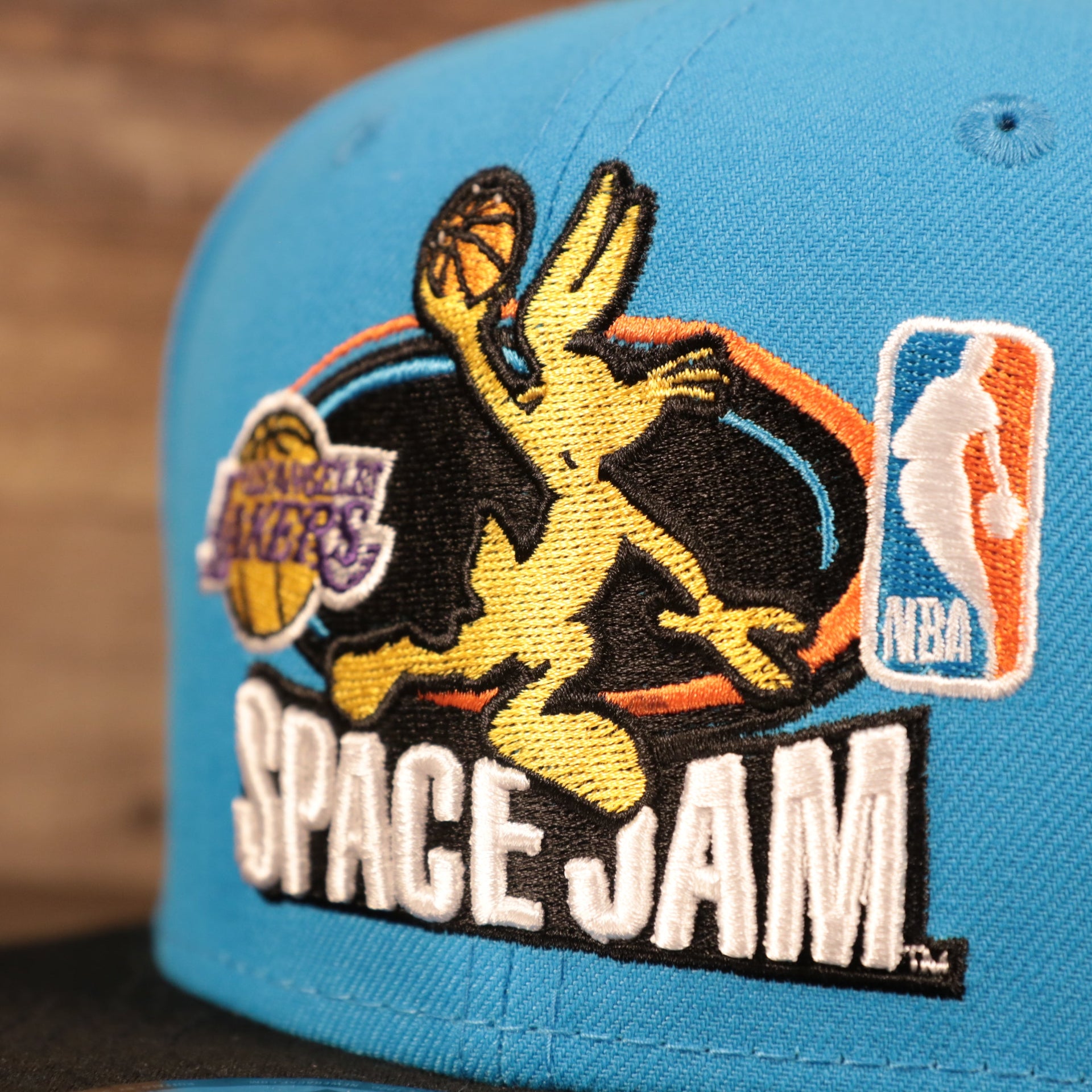Close up of the Los Angeles Lakers Bugs Bunny Lebron 18 Space Jam Matching 9Fifty Snapback Hat
