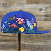 The wearer's right on the New York Mets Gray Bottom Bloom Spring Embroidery 59Fifty Fitted Cap | Royal Blue 59Fifty Cap
