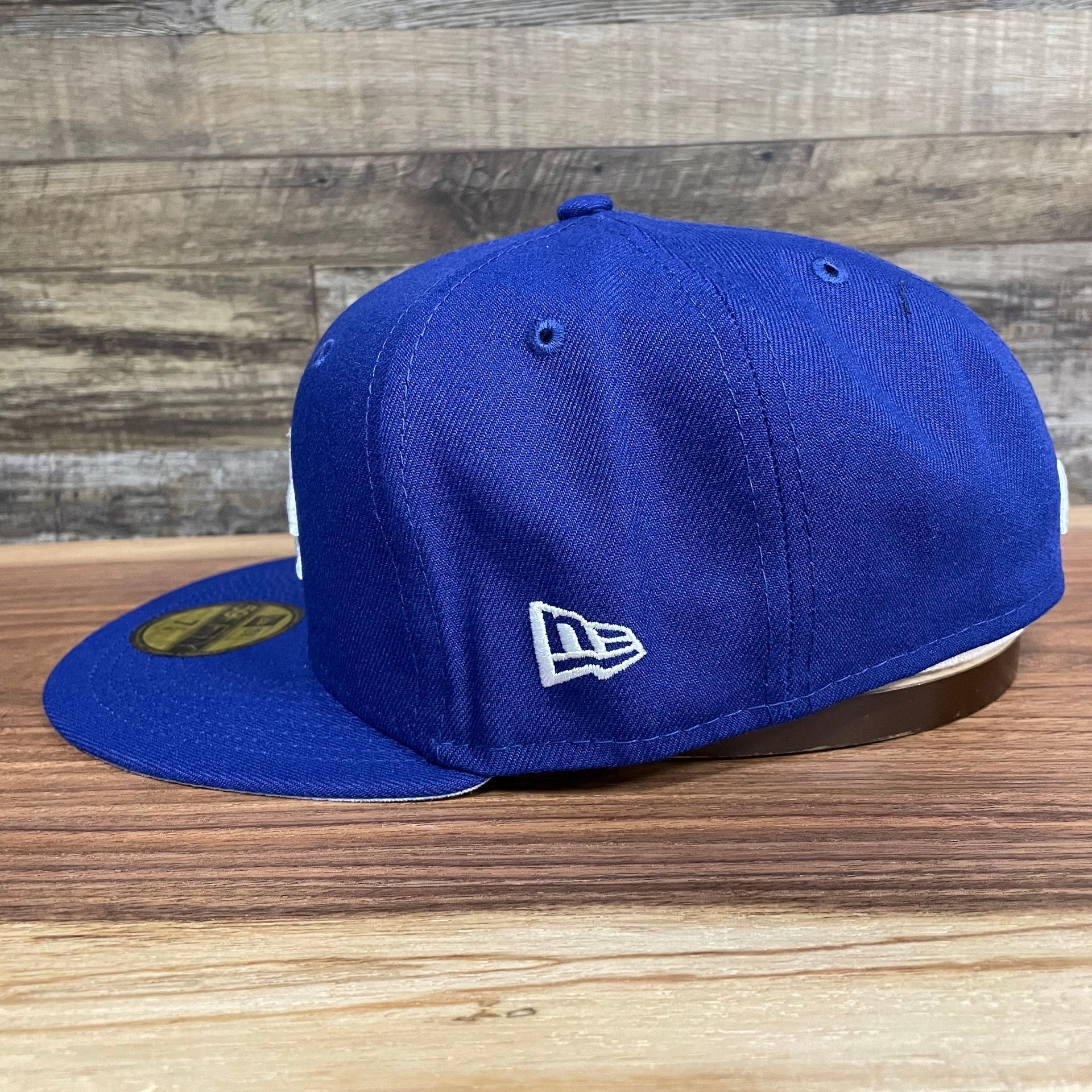 Wearer's left of the Los Angeles Dodgers "City Cluster" Side Patch Gray Bottom Royal 59Fifty Fitted Cap