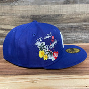 Wearer's right of the Los Angeles Dodgers "City Cluster" Side Patch Gray Bottom Royal 59Fifty Fitted Cap