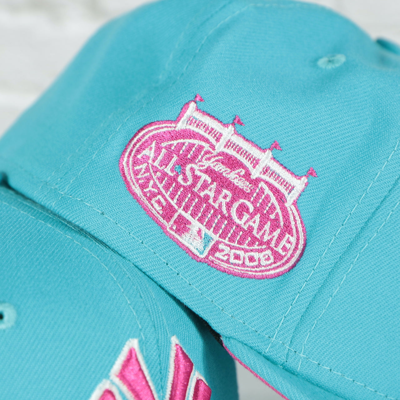 Close up of the 2008 All Star Game side patch of the New York Yankees Cooperstown 2008 All Star Game Magenta Under Bottom 59FIFTY Fitted Cap | Vice Blue Pack