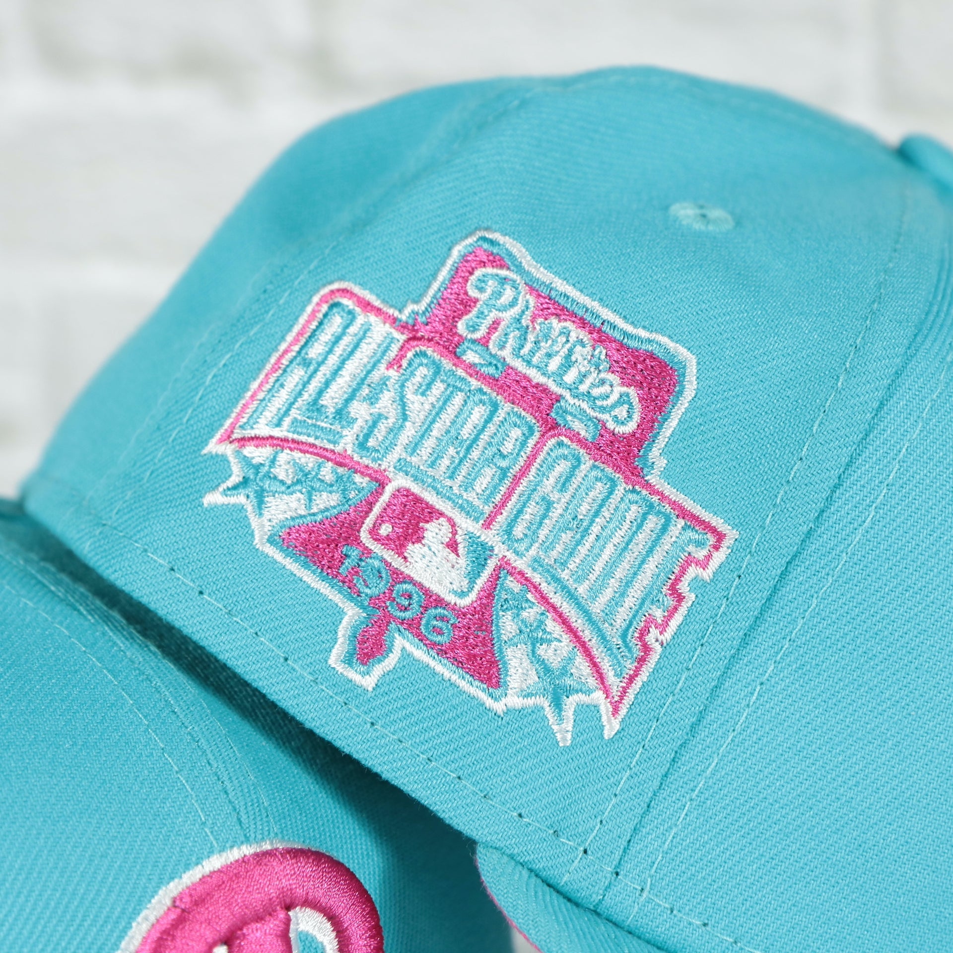Close up of the 96 side patch of the Philadelphia Phillies 1996 All Star Game Magenta Bottom 59FIFTY Fitted Cap | Vice Blue Pack