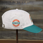 The wearer's right on the Throwback Miami Dolphins NFL Wordmark Side Patch Legacy Dad Hat | Bone Dad Hat