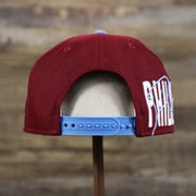 The backside of the Cooperstown Philadelphia Phillies MLB Side Font Green Bottom 9Fifty Snapback Cap | Maroon Snap Cap