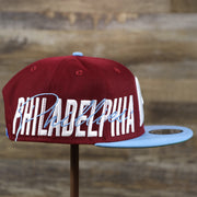 The wearer's right on the Cooperstown Philadelphia Phillies MLB Side Font Green Bottom 9Fifty Snapback Cap | Maroon Snap Cap