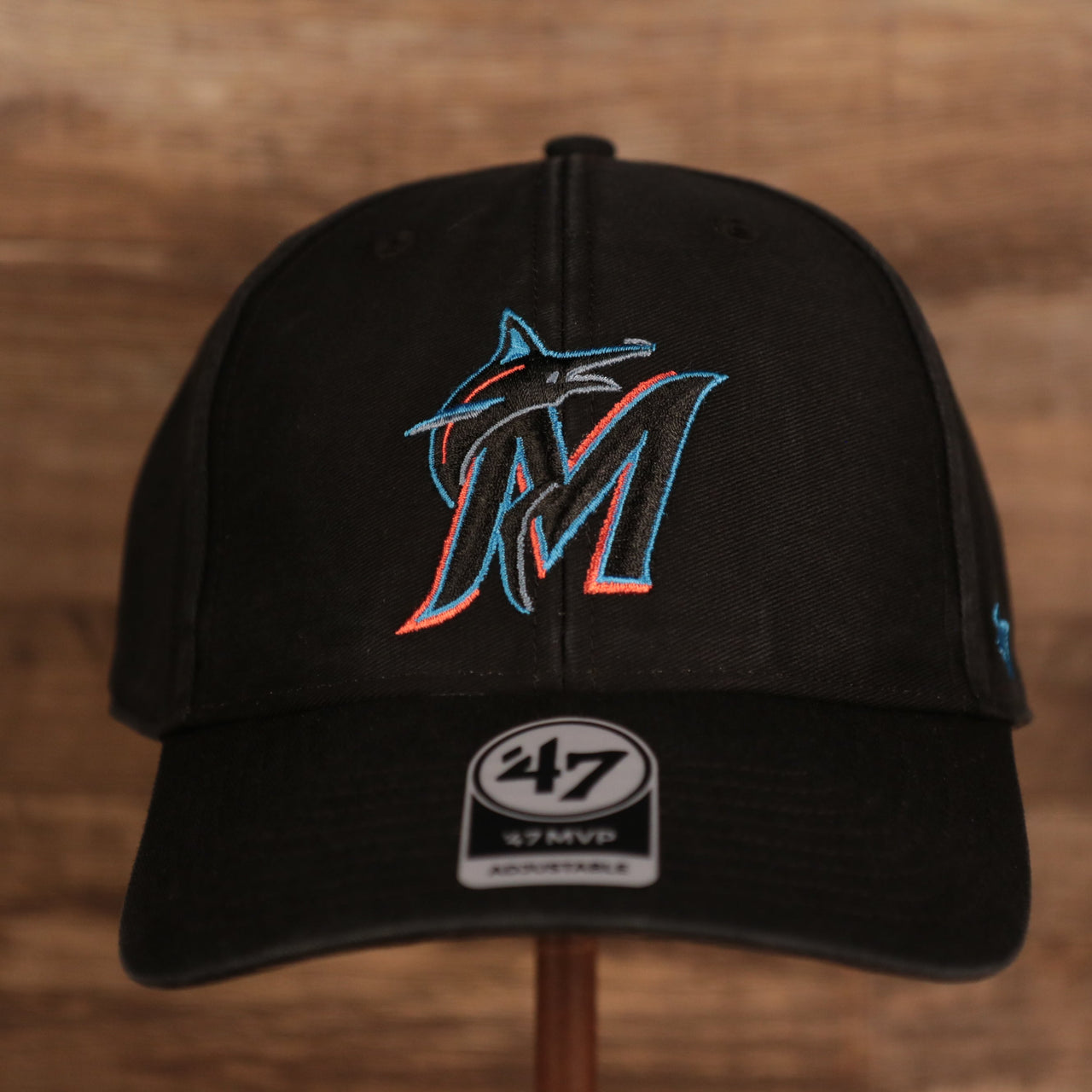 front of the Miami Marlins Black Adjustable Dad Hat