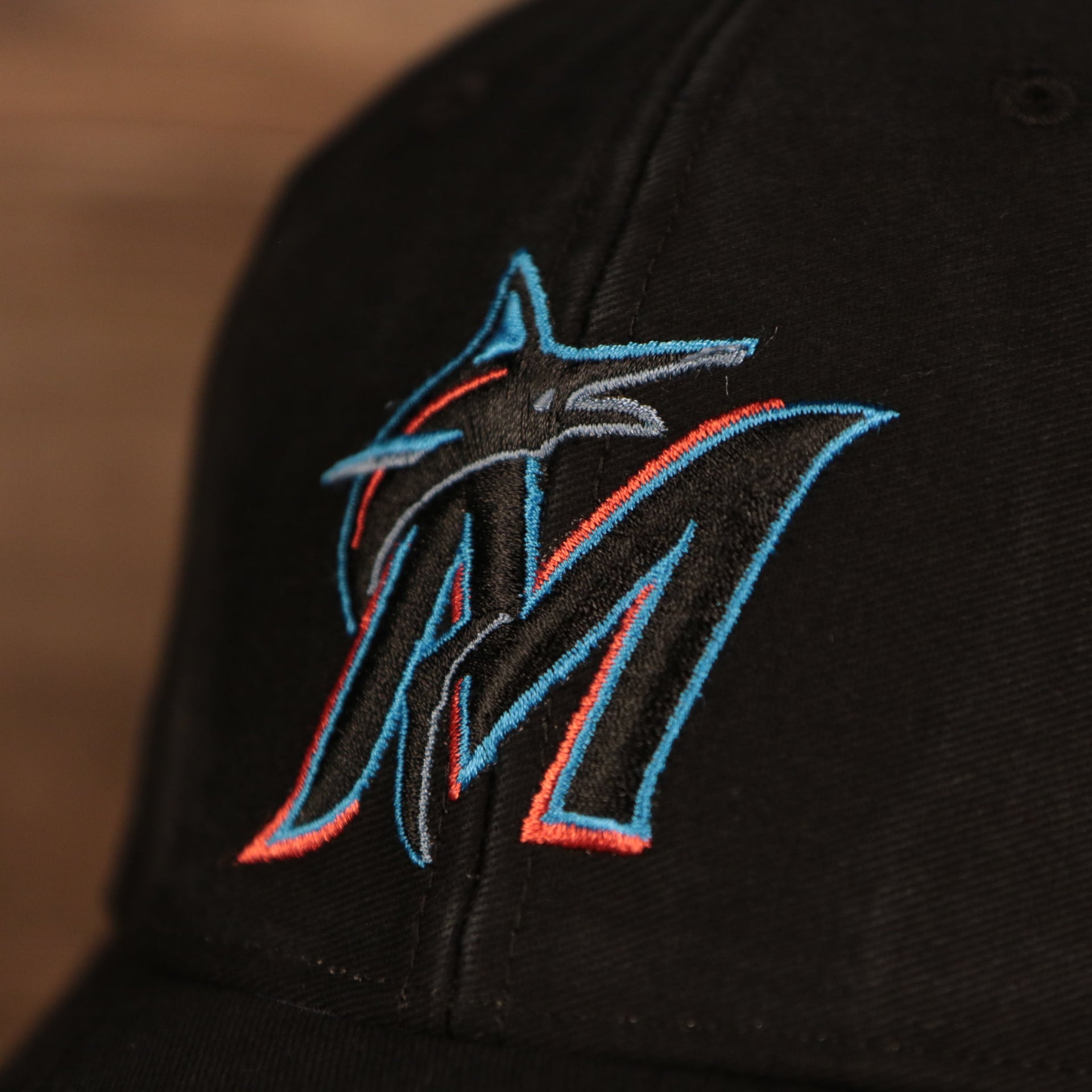 marlins logo on the front of the Miami Marlins Black Adjustable Dad Hat