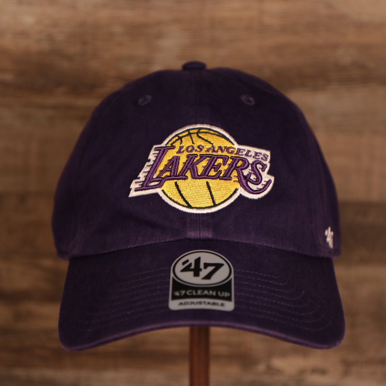 front of the Los Angeles Lakers Purple Adjustable Dad Hat