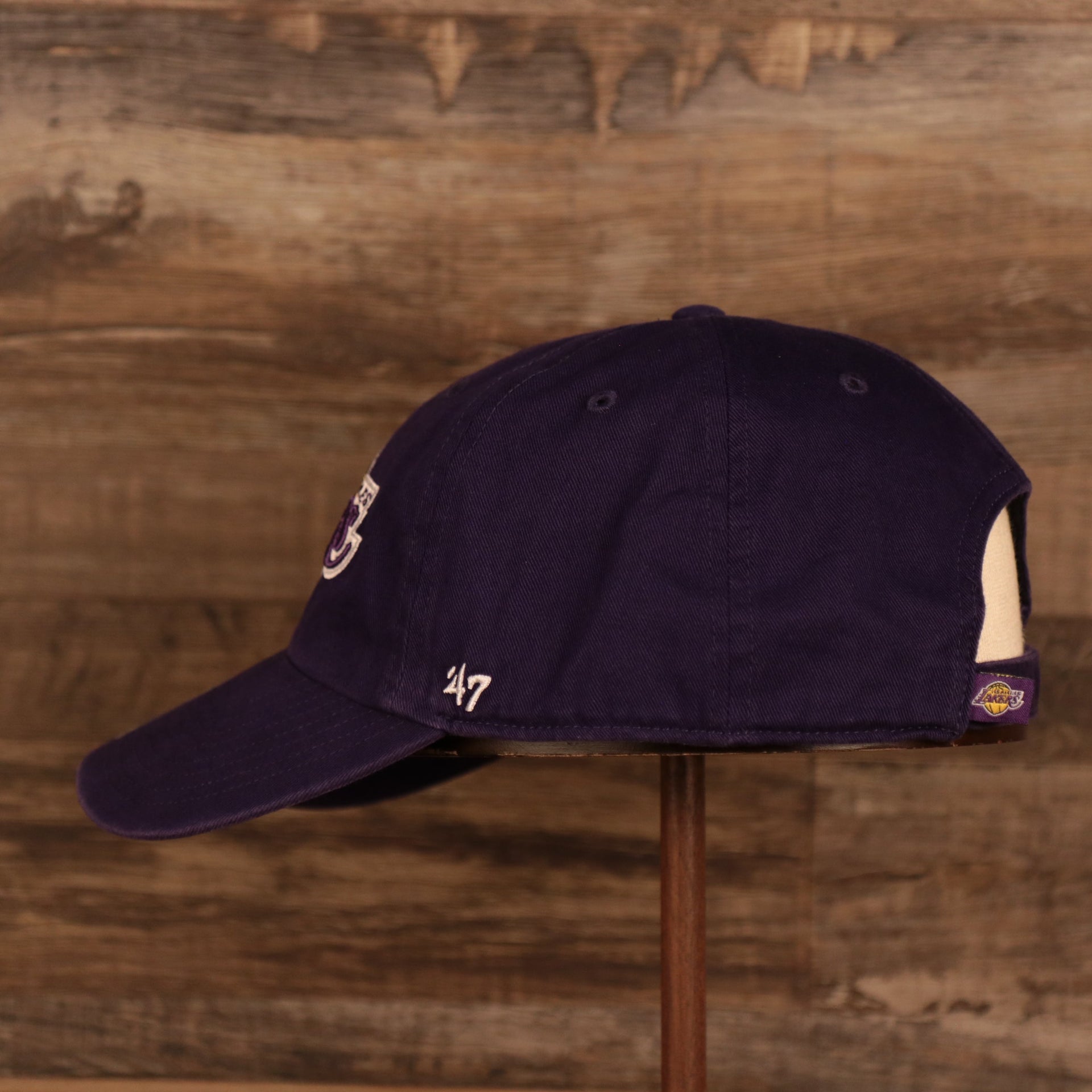 wearers left side of the Los Angeles Lakers Purple Adjustable Dad Hat
