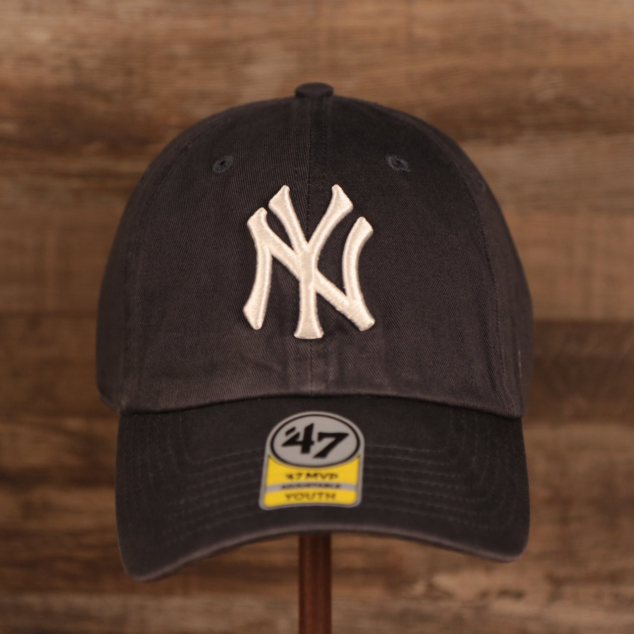 front of the New York Yankees Navy Blue Adjustable Youth Dad Hat