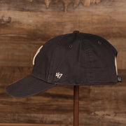 wearers left of the New York Yankees Navy Blue Adjustable Youth Dad Hat