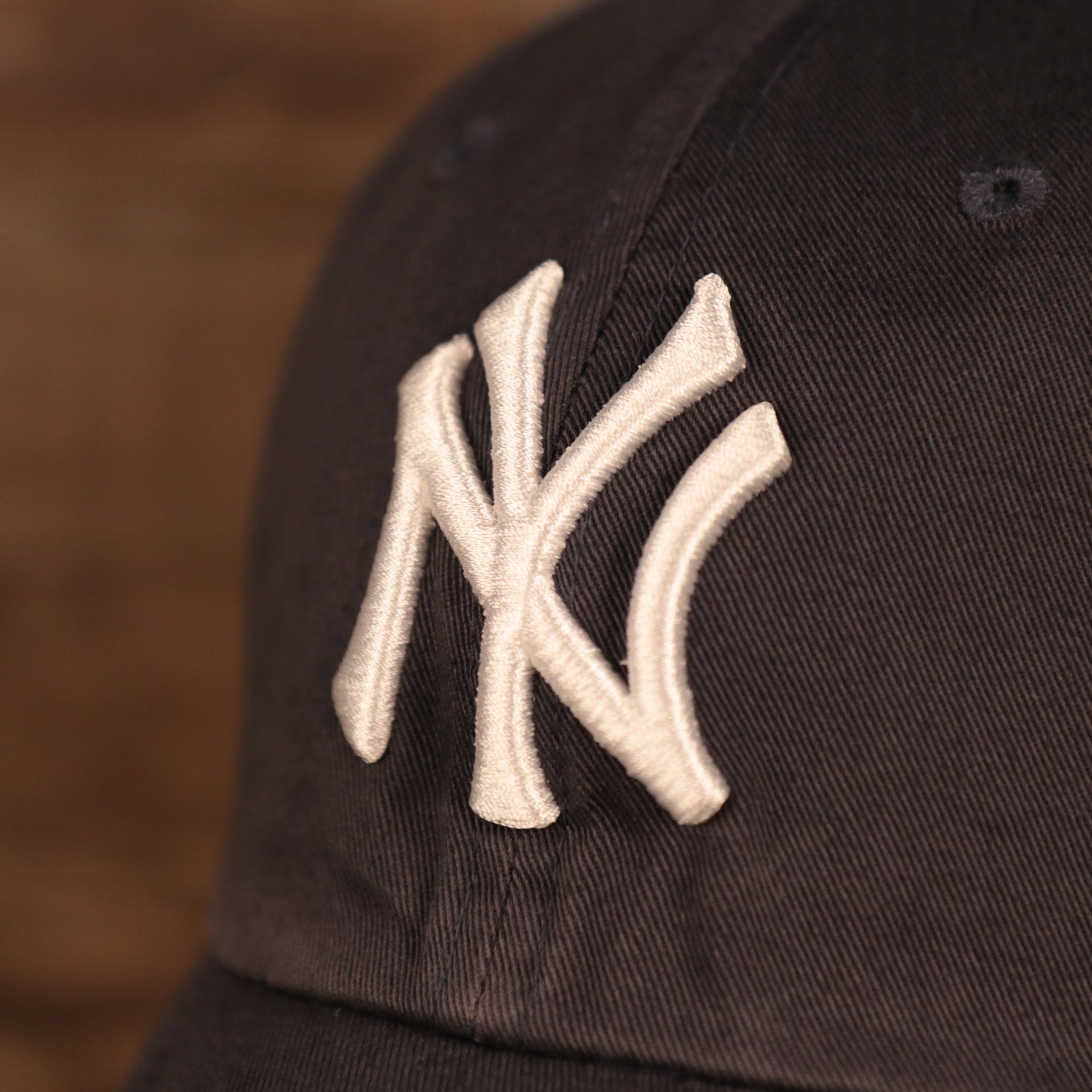 yankees logo shot on the New York Yankees Navy Blue Adjustable Youth Dad Hat