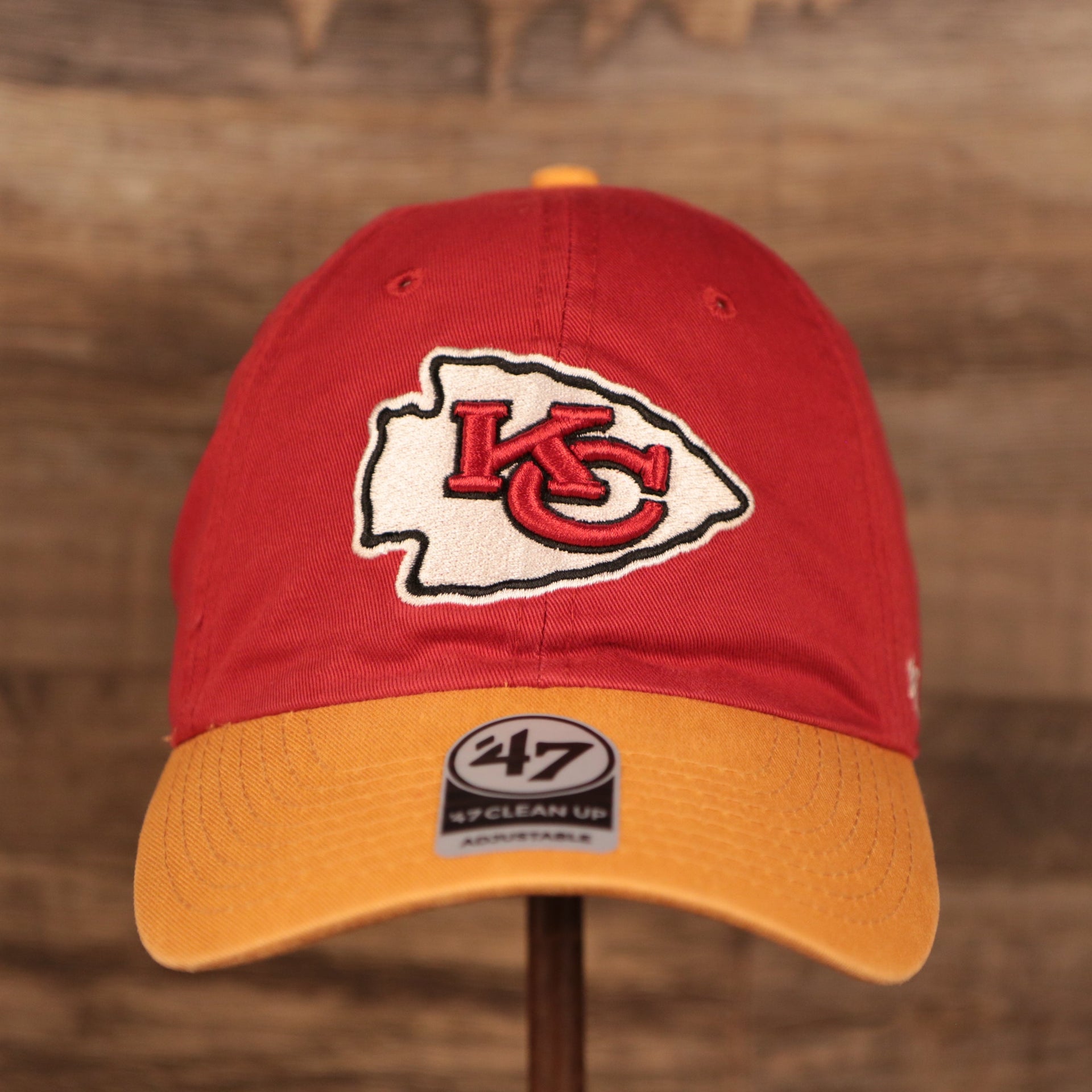 front of the Kansas City Chiefs Yellow & Red Adjustable Dad Hat
