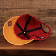 bottom of the Kansas City Chiefs Yellow & Red Adjustable Dad Hat