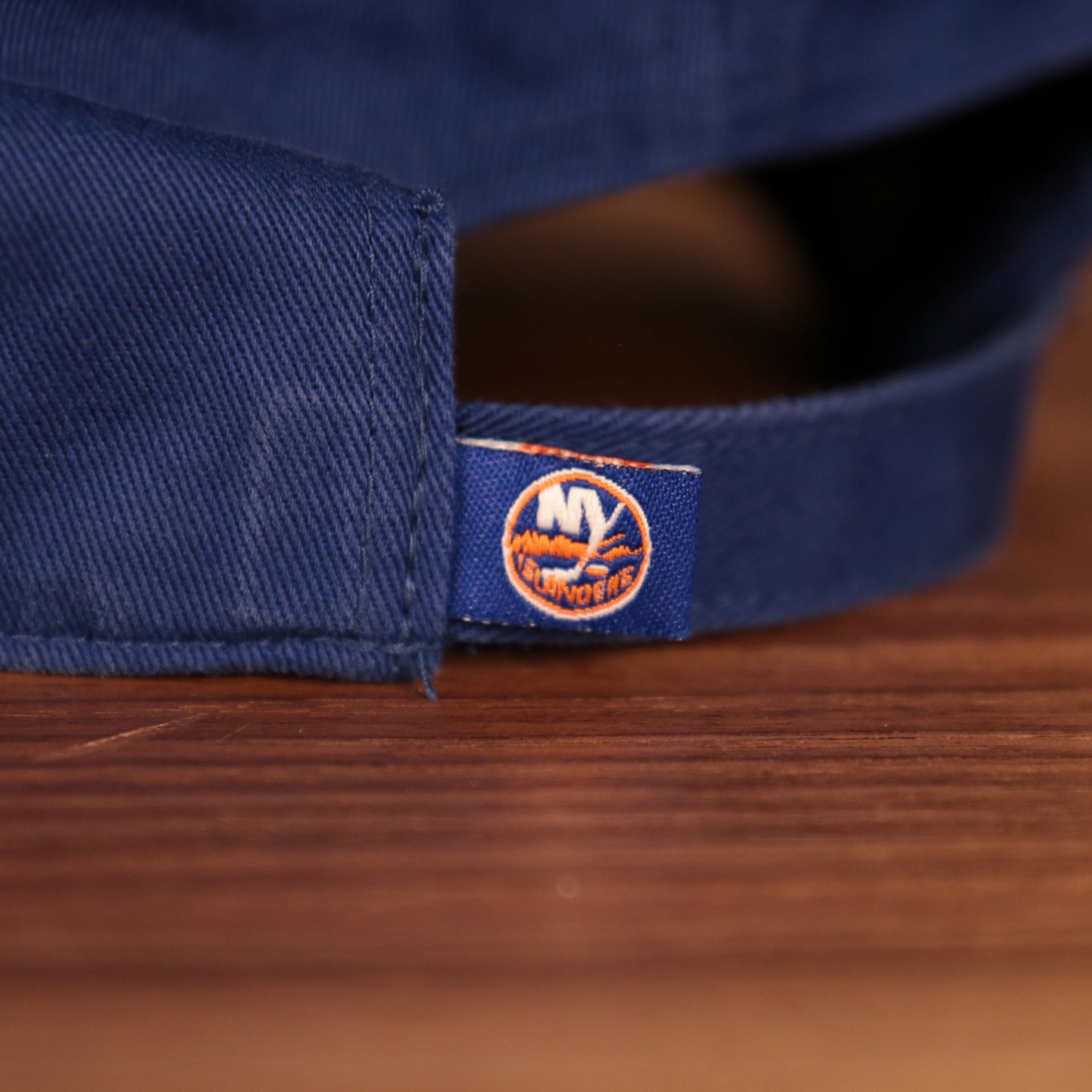 islanders tag on the strap of the New York Islanders Royal Blue Adjustable Dad Hat