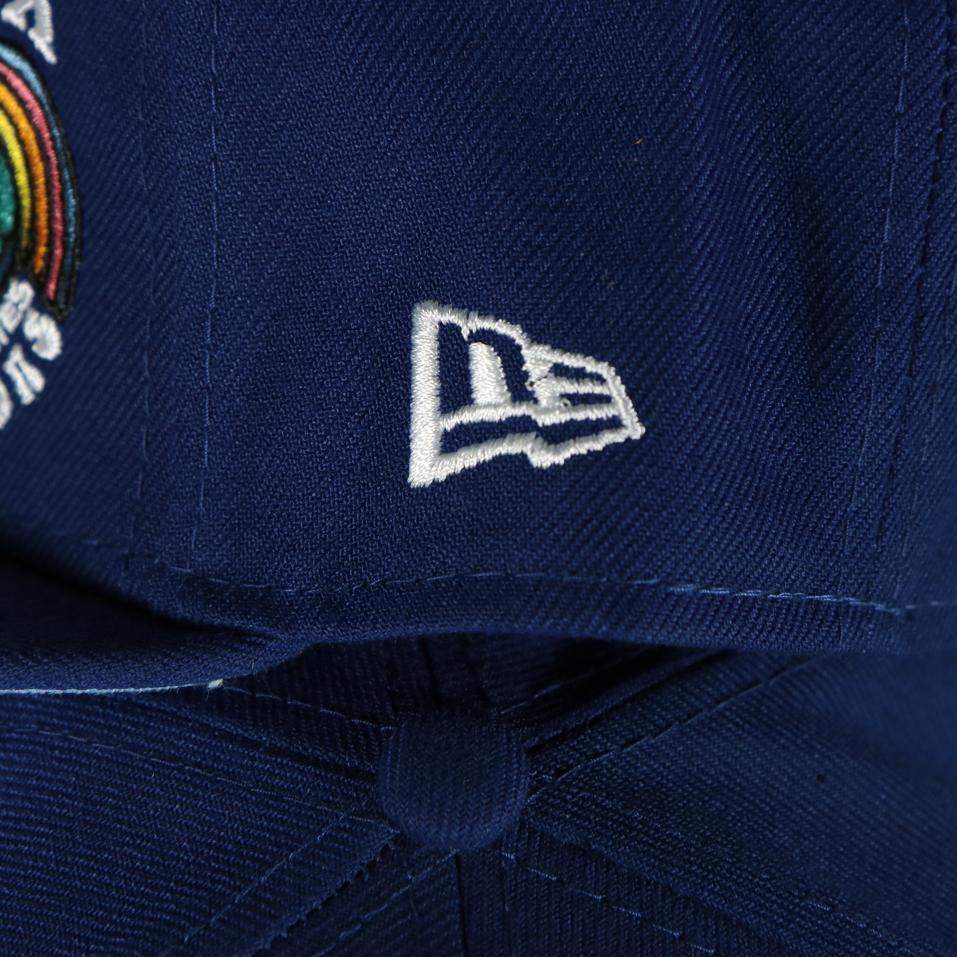 new era logo on the Los Angeles Dodgers Groovy World Series Champions Patch 59Fifty Fitted Cap | New Era Groovy Side Patch 5950