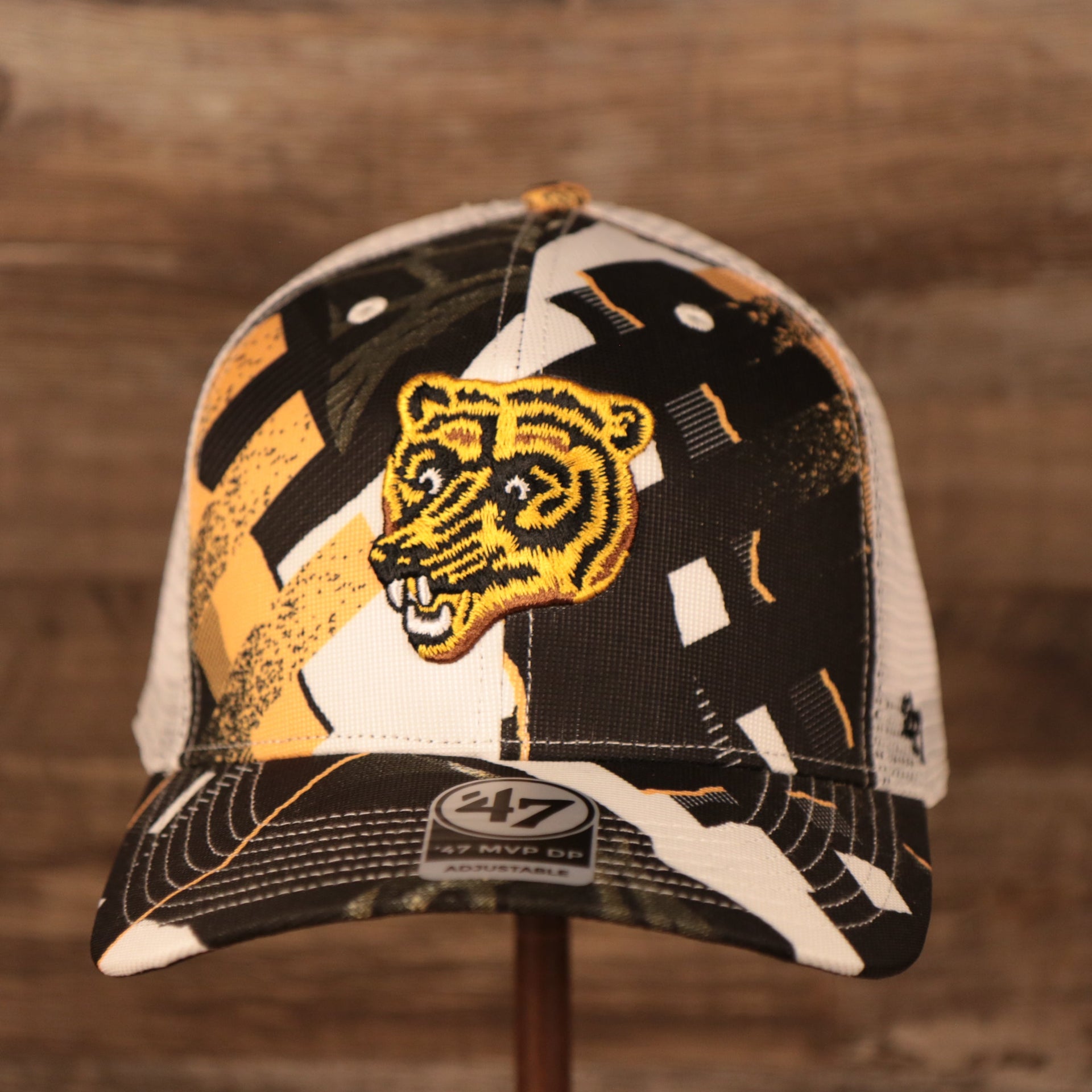 front of the Boston Bruins Brown, White, and Yellow Retro Adjustable Trucker Dad Hat