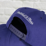 mitchell and ness logo on the New Orleans Jazz Vintage Retro NBA Team Ground 2.0 Mitchell and Ness Snapback Hat | Purple