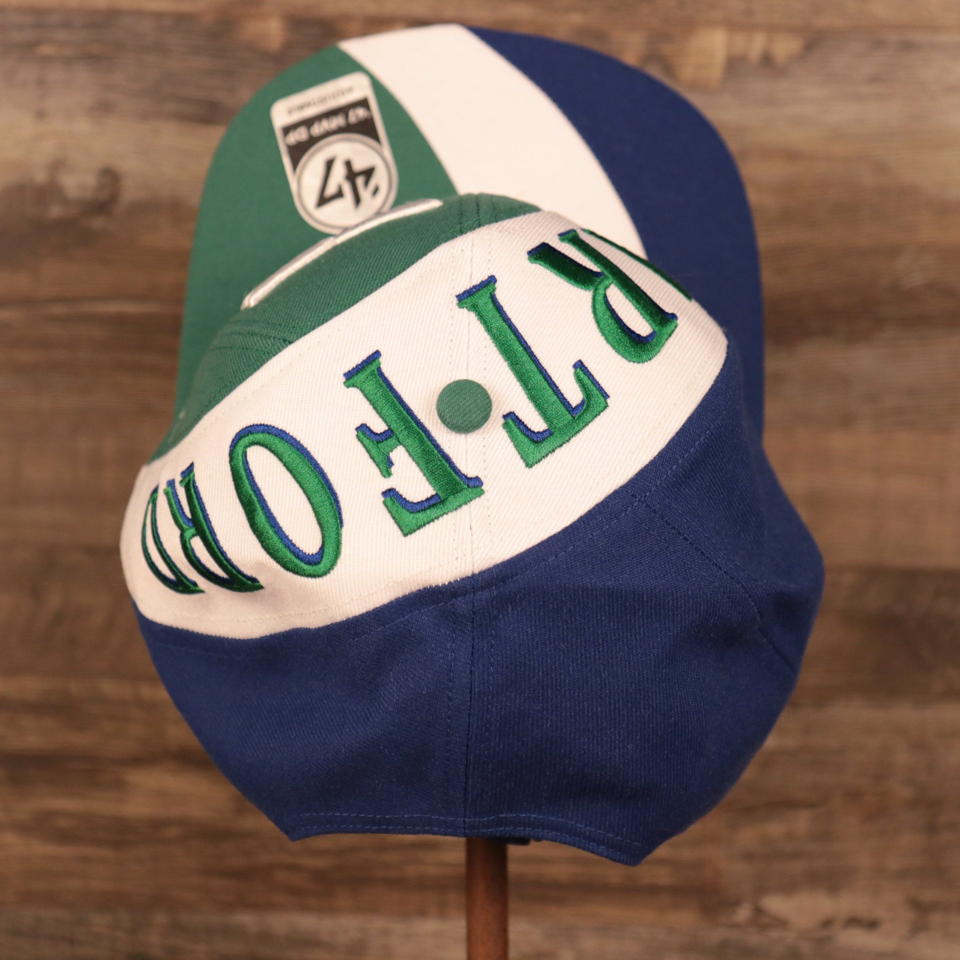 top view of the Hartford Whalers Blue White & Green Retro Adjustable Snapback Cap