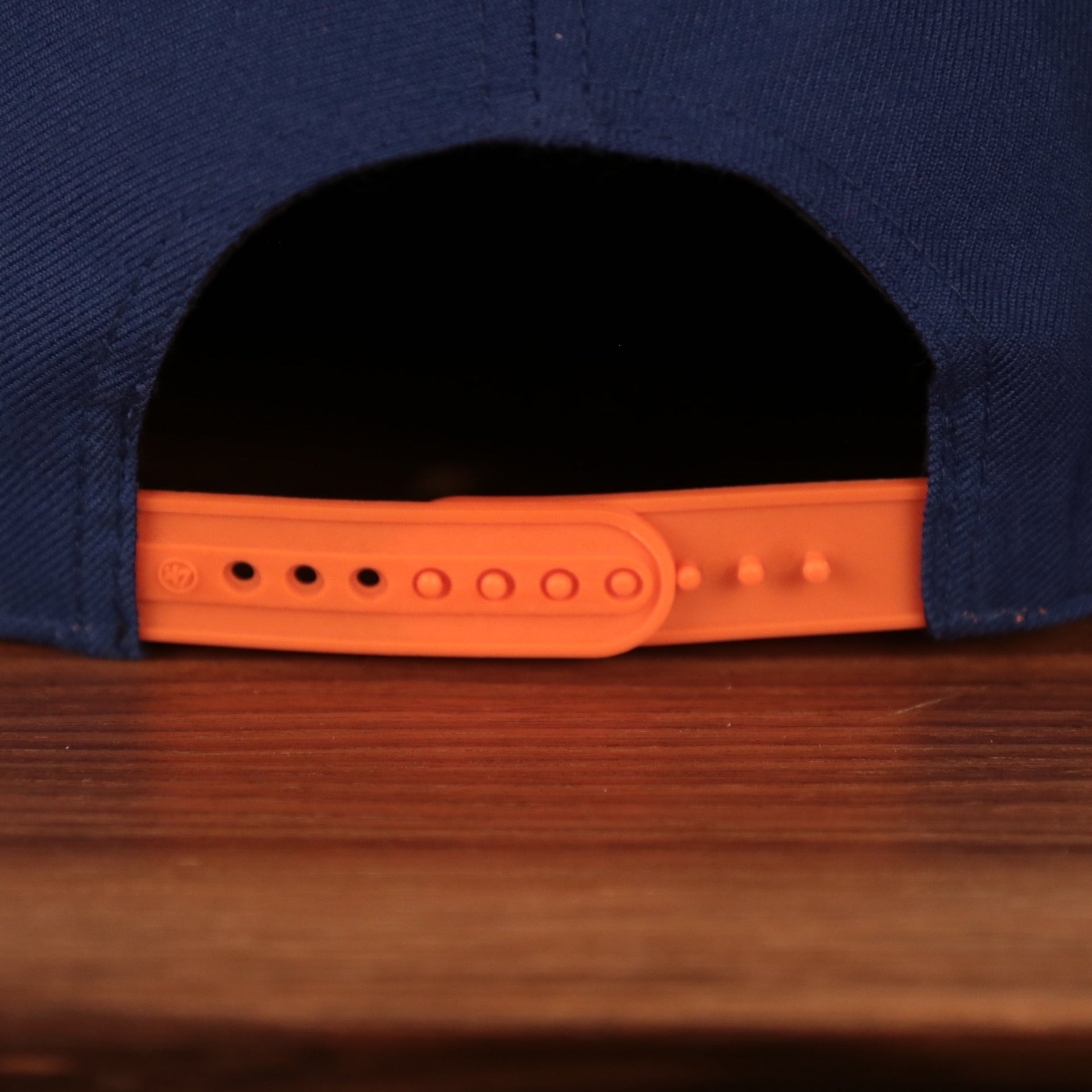 adjustable snap on the New York Knicks Royal Blue and Orange Adjustable Grey Bottom Snapback Hat
