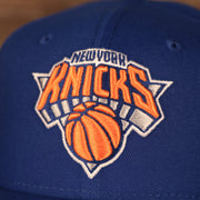A close up shot of the New York Knicks logo on the 2021 New York Knicks NBA Playoffs snapback hat