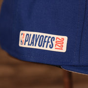 A close up shot of the 2021 Playoffs side patch on the New York Knicks 2021 NBA Playoffs Snapback Hat