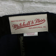 mitchell and ness label on theNew Jersey Nets Vintage Retro NBA Team 2 Tone Mitchell and Ness Snapback Hat | Navy/Red