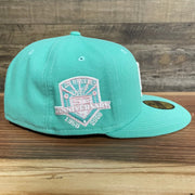 Wearer's right of the 50th Anniversary Los Angeles Dodgers Palm Tree Pink Bottom Side Patch 5950 Fitted | "Mint Flamingo"