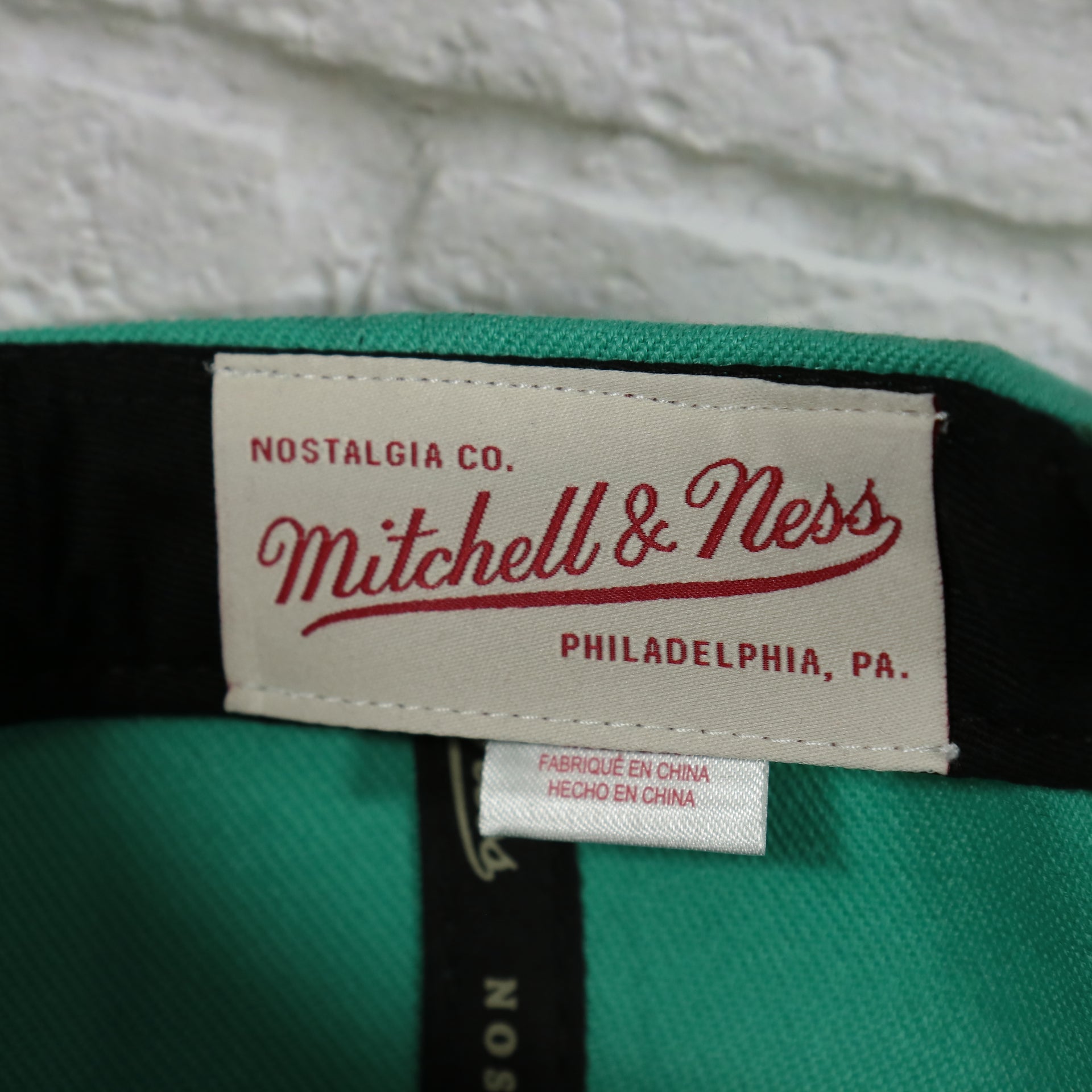 mtichell and ness label on the San Antonio Spurs Retroline Logo Outline Vintage Snapback Hat | Mitchell and Ness Spurs Snap Cap